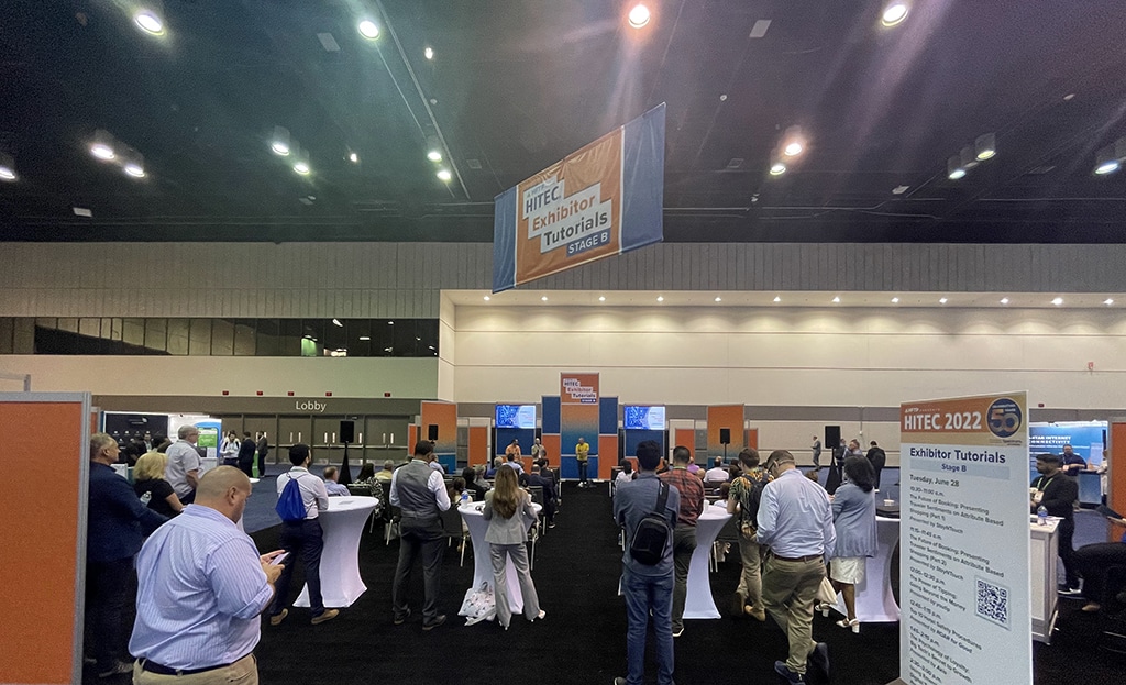 Snapshot of the busy trade show floor and the seminar stage, where Doug Brownell discussed "The Virtual Hotel: Empowering Operations with Intelligent Automation" with contemporaries in the hotel and country club industry.