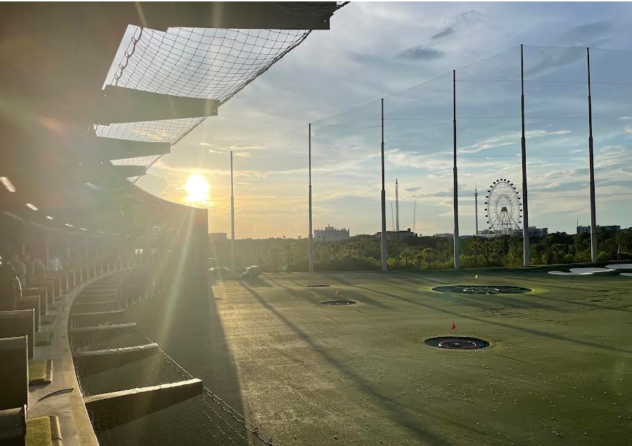 Beautiful Florida sunset over the Go Kart facility, featuring a cheerful ferris wheel in the background.