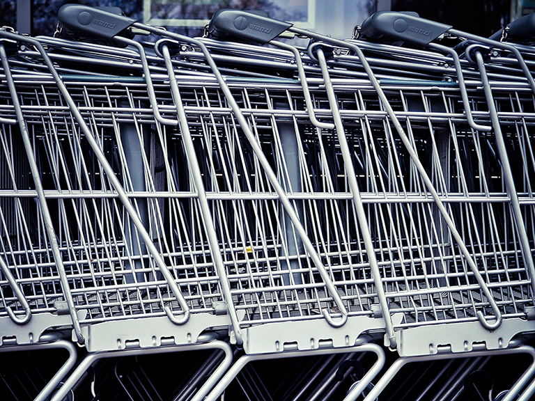 Image of neatly stacked silver and black grocery carts. You probably didn’t get into the grocery business to focus on software (or stack shopping baskets, for that matter). You want to be managing your inventory turnover ratio, not your tech stack. ERPs and one-size-fits-all software systems don't provide enough customization to support grocery store growth. 