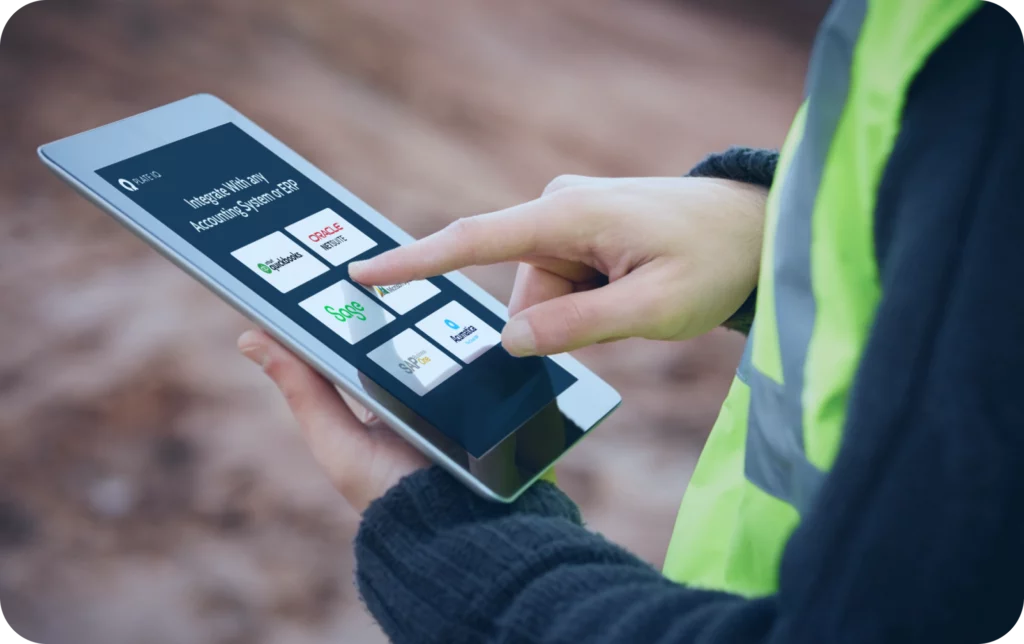 construction worker on site using tablet to automate ap through erp integration